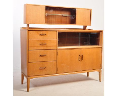A retro vintage circa 1960's Lebus Link Furniture oak veneer sideboard highboard. Having a partly glazed gallery top with twi