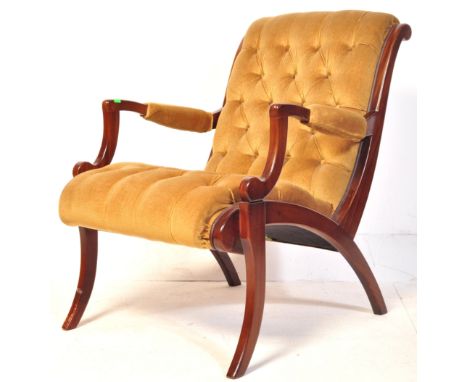 A retro vintage 20th century Bergere library chair having a mahogany chair with mustard velvet upholstery. Strongbow furnitur