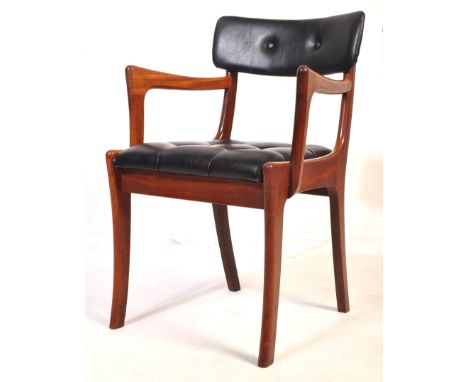 A retro vintage mid 20th century solid teak mid 20th century office chair having a buttoned back rest angular elbow rest, cus