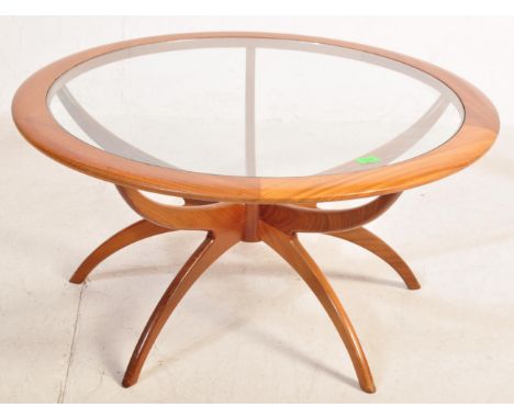 Victor B. Wilkins - G Plan - A 1960's retro vintage astro teak wood and glass ' Spider ' coffee table having a round inset gl