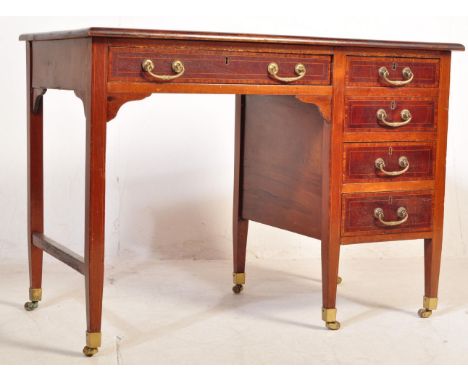 An early 20th Century Edwardian mahogany writing desk/table. Having a green leather writing surface with gilt tooled writing 