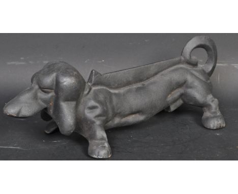 A vintage 20th century cast metal Dachshund dog boot scrape. Measures 32cm in length.&nbsp;
