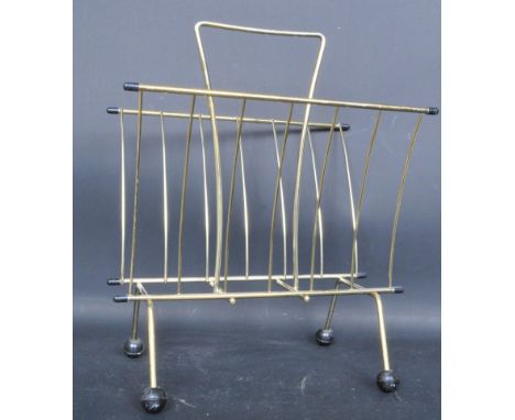 A vintage retro mid 20th century atomic sputnik style metal wire record vinyl rack having carry handle and black ball feet. M