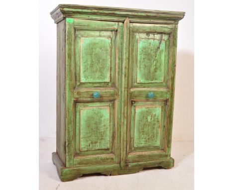 A vintage 20th century painted drinks cabinet having a flared top over fielded panelled doors raised on a plinth base. The ca