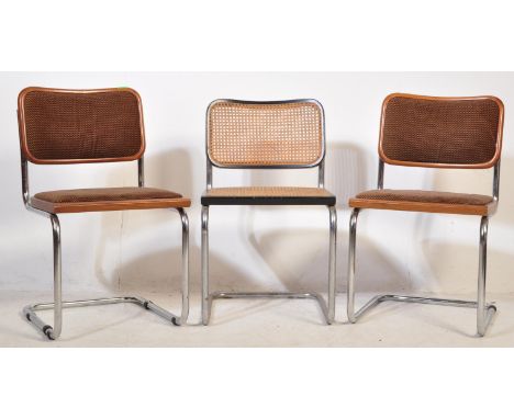 A collection of three retro vintage mid 20th Century Italian dining chairs. One of the chairs having a teak wooden frame with