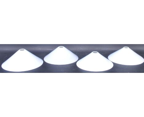 A set of four retro vintage 20th Century milk glass ceiling light shades of UFO conical form. Measures 25cm diameter.&nbsp;