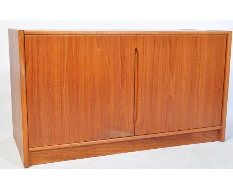 A teak retro vintage mid 20th Century circa 1960's large cabinet / sideboard. The sideboard having twin large cupboard/cabine