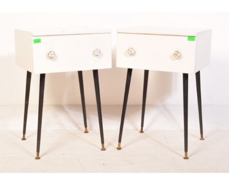 A pair of retro vintage mid 20th Century painted bedside tables. The tables of square form having a single drawer with floral
