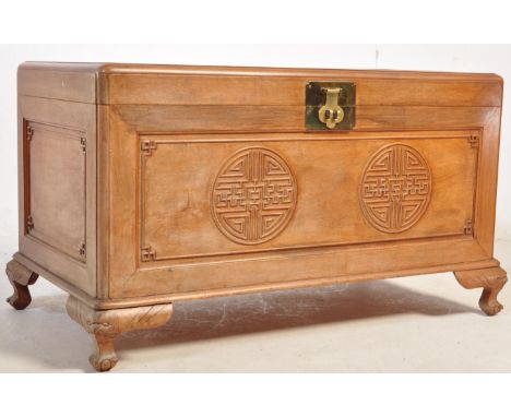 A mid 20th century Chinese Oriental hardwood chest / trunk having chinese carvings to the lid and sides raised on cabriole fe