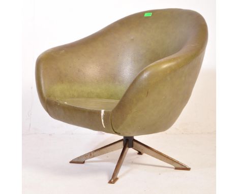A retro vintage mid 20th century tub chair upholstered in a mottled olive green faux vinyl fabric raised upon a chrome tripod