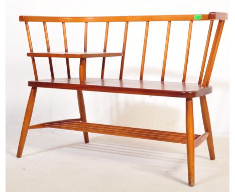 A retro vintage mid 20th century elm telephone table in the manner of Ercol and Chippy Heath furniture. The bench having a be