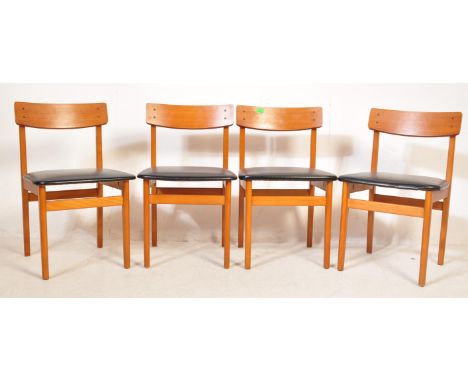 A set of 4 retro vintage circa 1970s teak dining chairs. In the manner of G Plan with a curved backrest, black vinyl cushione
