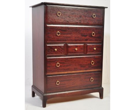 A retro vintage circa 1980s mid 20th century African Cherrywood Stag Minstrel tallboy chest of drawers. having a bank of two 
