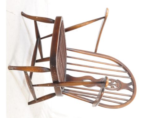 Lucian Ercolani - Old Colonial - A retro vintage mid 20th century L22 Ercol elm and beech Windsor Bergere easy chair having c