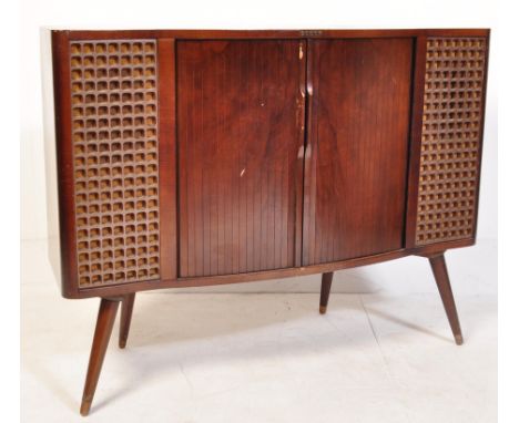A retro vintage mid 20th century walnut veneer Decca stereogram having twin tambour roll doors opening to reveal record playe