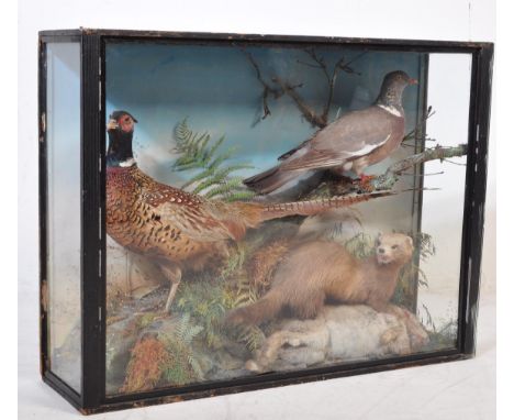 Of taxidermy interest - a vintage 20th century taxidermy pheasant within a naturalistic setting. Set within a glass box. Meas