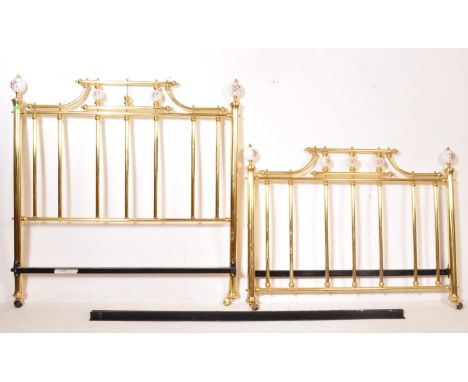 A 20th century Victorian style brass and ceramic bed frame having floral ceramic ball decoration to the bed posts. Measures 1
