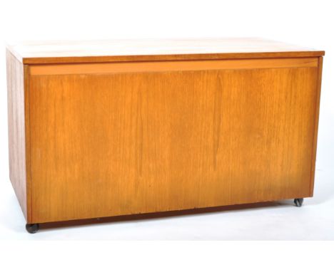 A retro vintage mid 20th Century teak wood ottoman / blanket box of simple rectangular form having a full length hinged lid o