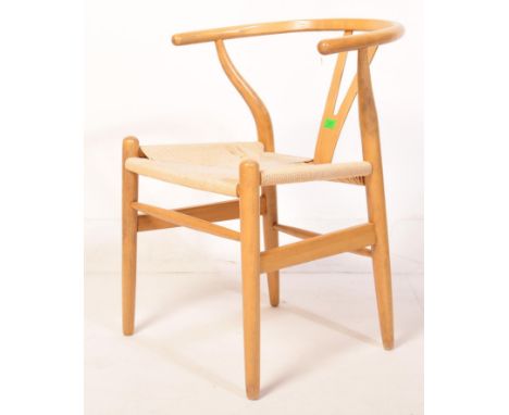 A retro vintage mid 20th Century in the manner of Hans Wegner bentwood beech frame wishbone chair. The chair having a 'Y' cur