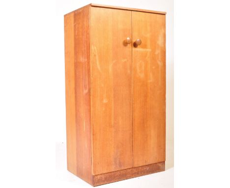 G-Plan - A mid 20th century retro vintage circa. 1960's G Plan tall boy cabinet having two twin doors with knob handles openi