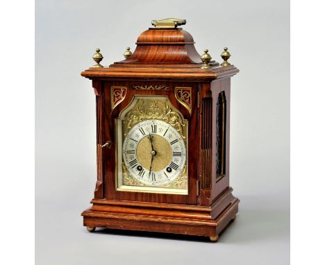 A WALNUT AND BRASS MOUNTED MANTEL CLOCK, late 19th century, the brass dial with a 4 1/2" silvered chapter ring, on a brass, e