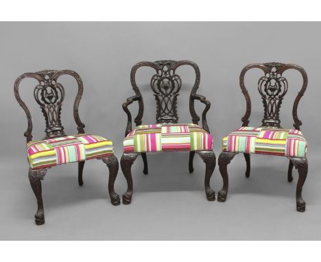 A SET OF EIGHT MAHOGANY CHIPPENDALE STYLE DINING CHAIRS, early 20th century comprising six dining chairs and two carvers, wit