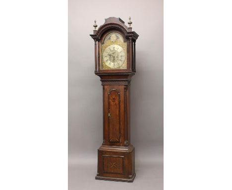 AN OAK AND MAHOGANY CASED LONGCASE CLOCK. With a silvered dial with subsiduary seconds and date dials with late 18th century 