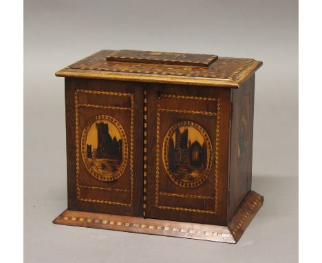 A KILLARNEY WARE TABLE CABINET. The cabinet with twin doors beneath a rising stepped top, the interior fitted with three draw