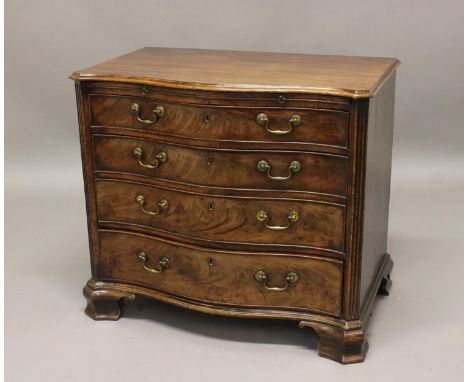 A GEORGE III MAHOGANY SERPENTINE FRONTED DRESSING CHEST, the serpentine top above a brushing slide and four graduated drawers