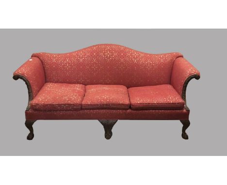 A CHIPPENDALE STYLE MAHOGANY FRAMED SETTEE. A George III style settee with an arched upholstered back, raised scroll top arms