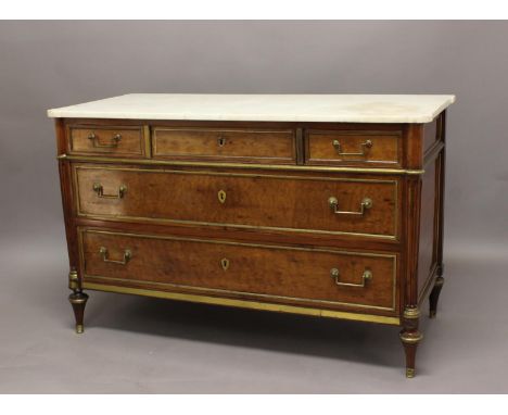 A 19TH CENTURY FRENCH EMPIRE STYLE MARBLE TOPPED COMMODE, the shaped marble top above an arrangement of three short over two 