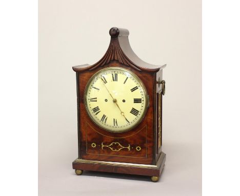A REGENCY BRASS INLAID BRACKET CLOCK. A Regency mahogany bracket clock with cream enamelled dial with Roman numerals with a t