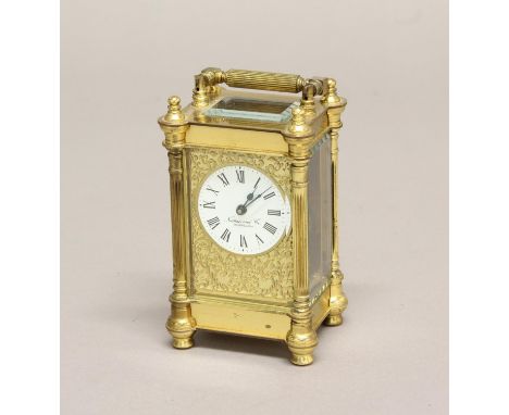A VICTORIAN STYLE BRASS CASED CARRIAGE CLOCK BY NATHAN OF BIRMINGHAM. A brass cased carriage with circular white enamelled di