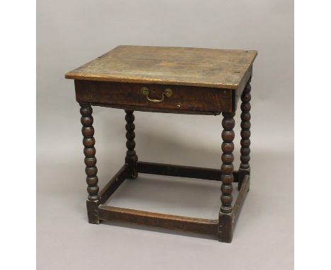 AN 18TH CENTURY OAK SIDE TABLE, the rectangular top above a single drawer with offset handle on bobbin turned legs and box st