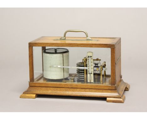 AN OAK CASED BAROGRAPH BY DOBBIE SON &amp; HUTTON.&nbsp;An oak cased barograph with an applied makers label for Dobbie Son &a