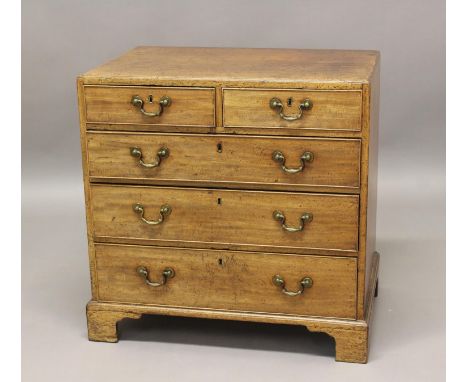 A LATE GEORGE III MAHOGANY CHEST OF DRAWERS. The chest with a rectangular caddy moulded top above two short and three long gr