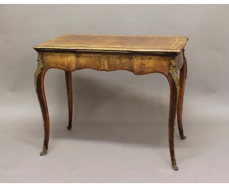 A 19TH CENTURY FRENCH WALNUT CARD OR GAMES TABLE, the shaped rectangular fold-out and swivel top above a wavy frieze on cabri