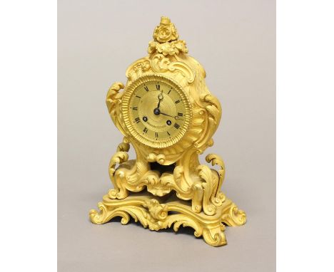 A FINE 19TH CENTURY ORMOLU MANTLE CLOCK. The gilt dial with Roman Numerals signed 'Huguenin A Paris' with an eight day two tr