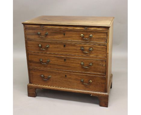 GEORGE III MAHOGANY BACHELOR'S CHEST, with four graduated drawers below a brushing slide, on bracket feet, height 82cm, width