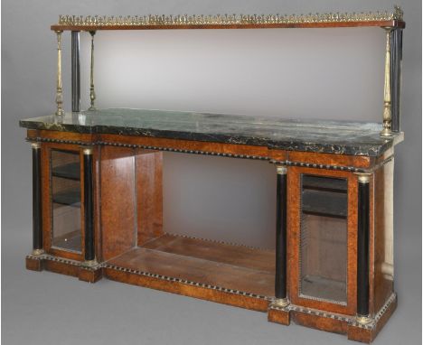 A 19TH CENTURY FRENCH MARBLE TOPPED SIDEBOARD. The veined black marble top with inverted break front beneath a broad rectangu