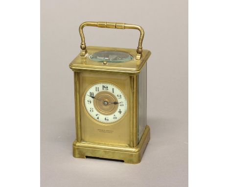 A LATE 19TH CENTURY BRASS CASED CARRIAGE CLOCK. With enamelled chapter ring with arabic numerals, marked 'Weber &amp; Schenck
