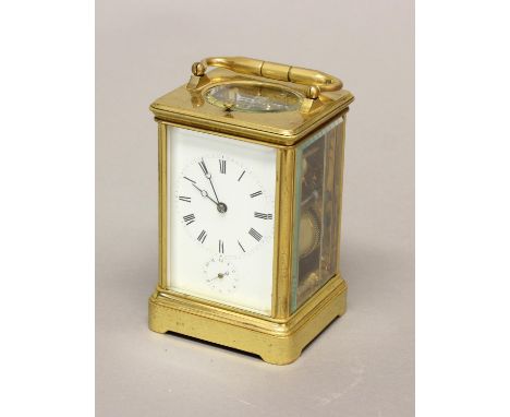 A 19TH CENTURY CARRIAGE CLOCK BY DROCOURT FRERES. A brass cased carriage clock with white enamelled dial with Roman numerals,