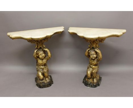 A PAIR OF 18TH/19TH CENTURY CONSOLE TABLES. The matching pair of tables with white marble tops with serpentine scrolling bord