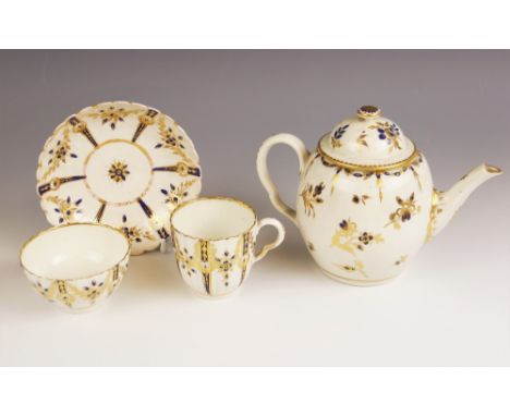 A Worcester porcelain teapot and associated cover, circa 1780, the barrel shaped body decorated in mazarine blue and gilt flo