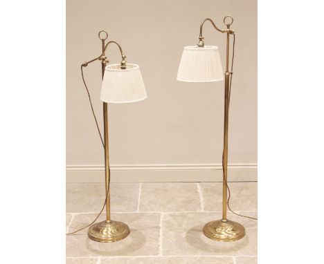 Christopher Wray, London, a pair of lacquered brass floor standing reading lamps, late 20th century, each with an adjustable 