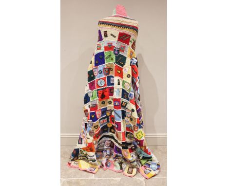 SCOUTS/GUIDES INTEREST: A crocheted patchwork blanket, late 20th century, extensively applied with Girl Guides and Cub Scouts