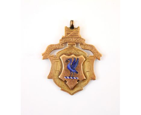 A Victorian 9ct gold Liverpool cross country fob medal, the shield shaped medal with raised cartouche depicting enamel liver 