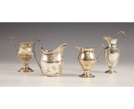 A Victorian silver cream jug, Henry Wilkinson and Co, London 1872, the garland and foliate engraved body above a pedestal bas