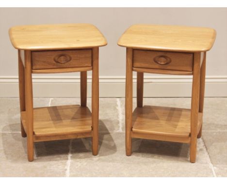 A pair of Ercol 'Windsor' honey elm lamp tables, late 20th century, the figured rectangular tops above a single frieze drawer