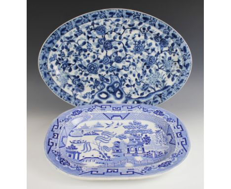 A collection of blue and white meat plates, 19th century and later, comprising; a Willow pattern oval meat plate, with comb b